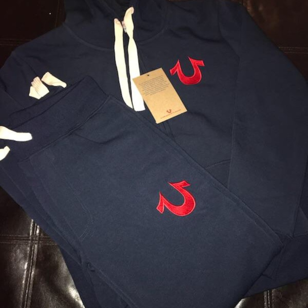 Navy blue suit with red logo